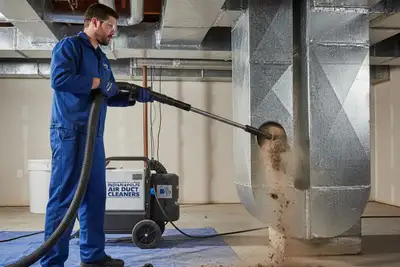 Technician cleaning air ducts with professional equipment in Indianapolis IN home to restore HVAC efficiency