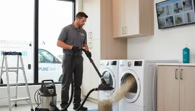 Technician cleaning dryer vent for home safety in Indianapolis, IN by Five Star Cooling